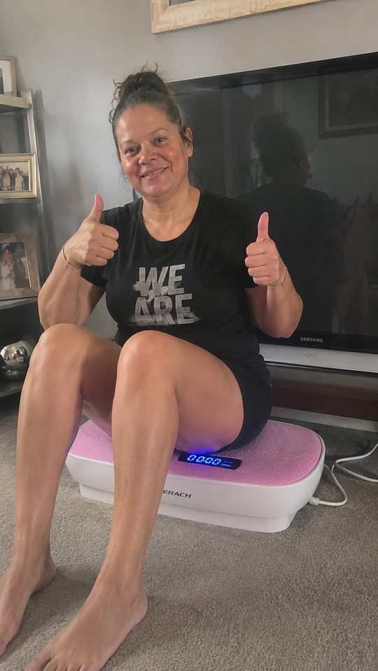Happy LumiFit customer using the vibration board