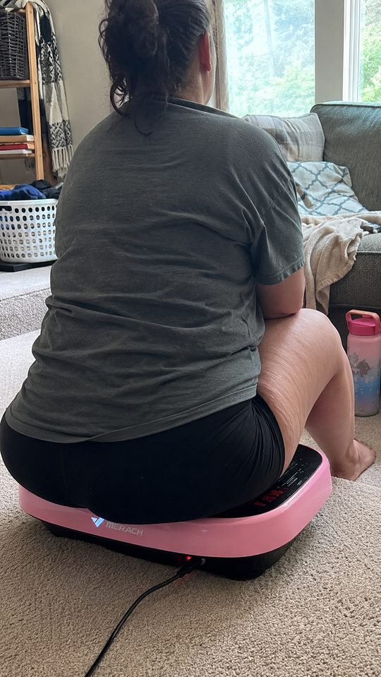 Happy LumiFit customer using the vibration board