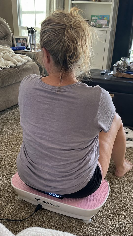 Happy LumiFit customer using the vibration board